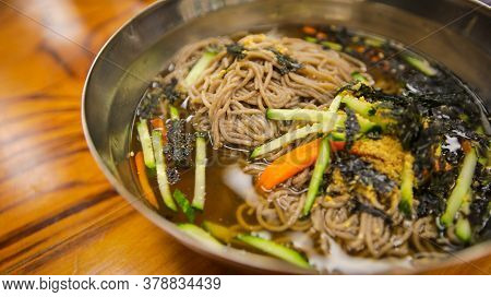 Close Up Image Of Korean Summer Speciality Food, Cold Buckwheat Soba Noodles,memil Guksu, On A Stain