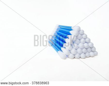 Ear Sticks With Blue Plastic On A White Background. Personal Hygiene And Self-care. Cosmetology And 