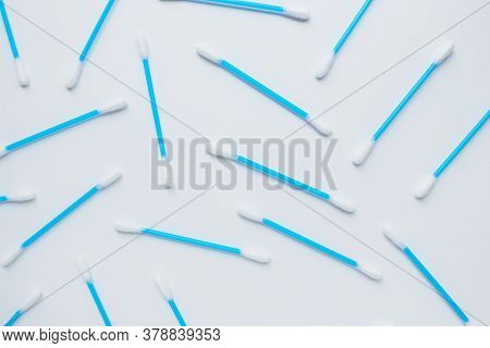 Ear Sticks With Blue Plastic On A White Background. Personal Hygiene And Self-care. Cosmetology And 