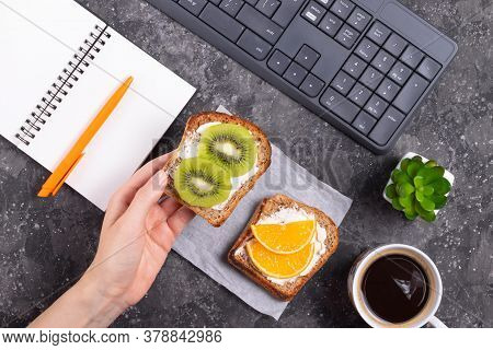 Woman Holding A Sandwich With Cream Cheese And Kiwi In Her Hand A Healthy Snack On Freelance