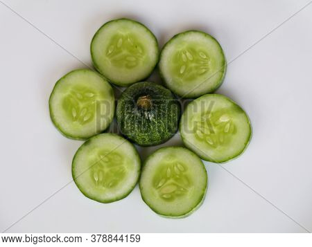 Fresh Raw Sliced Cucumber In White Background- Organic And Healthy Vegetable.