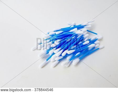 Ear Sticks With Blue Plastic On A White Background. Personal Hygiene And Self-care. Cosmetology And 