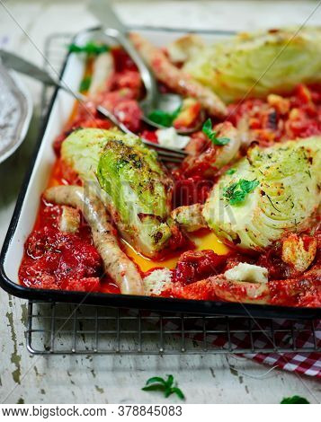 Baked Sausage With Cabbage Traybake..style Rustic.selective Focus