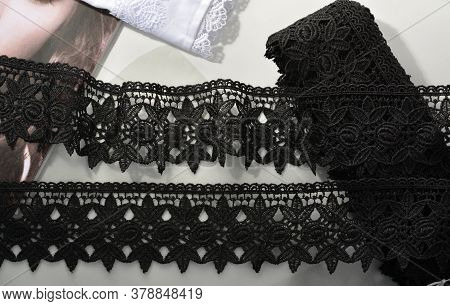 Tapes Of Black Gentle Guipure, Beauty Lace Fabric On Light Background. Elastic Material. Using For A