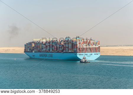 Suez, Egypt - November 14, 2019: Large Container Vessel Ship Moscow Maersk Passing Suez Canal In The