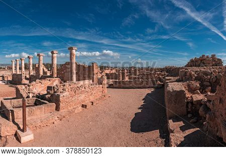 Ancient Ruins Of Kourion City Near Pathos And Limassol, Cyprus. Row Of Columns Under Blue Sky. Trave