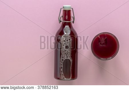 Sour Cherry Drink With Ice In A Glass And Bottle. Top View, Copy Space For Text. The Concept Of Cold