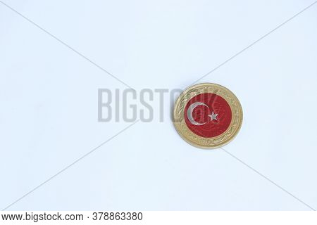 Turkey Flag On The Coin Of One Turk Lirasi Or Turkish Lira Money On The White Background. Concept Of
