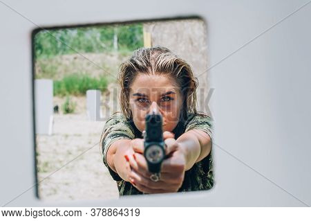 Close-up Abstract View Of Attractive Female Army Soldier Have Gun Shooting Training From Behind And 