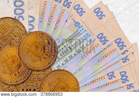 500 Ukrainian Hryvnias Bills And Golden Bitcoins. Cryptocurrency Investment Concept. Crypto Mining O