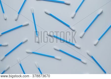 Ear Sticks With Blue Plastic On A White Background. Personal Hygiene And Self-care. Cosmetology And 