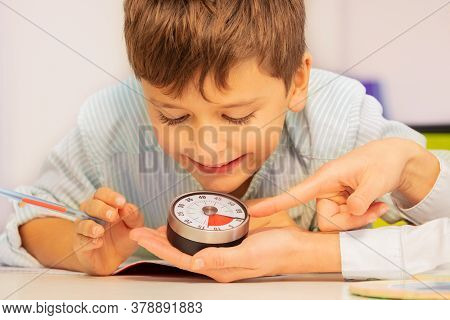 Boy With Autism Spectrum Disorder During Aba Therapy Look At Lesson Timer In Teachers Hands Understa
