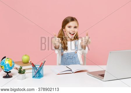 Funny Little Kid Schoolgirl 12-13 Years Old Sit Study At White Desk With Pc Laptop Isolated On Paste