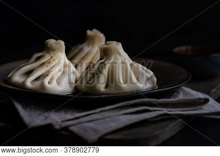 Traditional Georgian Khinkali Dish On Stone Background