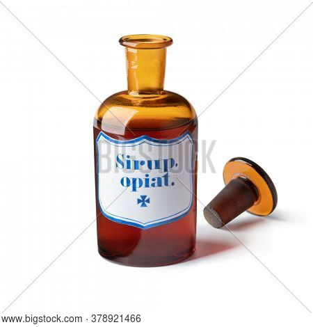 Historic old open pharmacy bottle with opium syrup isolated on white background