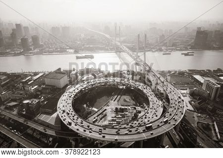 Shanghai Nanpu Bridge over Huangpu River with busy traffic in China.
