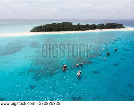 Aerial View Of Mnemba Atoll In Zanzibar - The Famous Spot For Snorkeling And Boat Tour