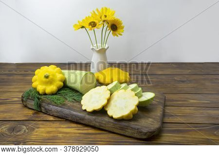 Green Zucchini And Yellow Pattisons, Chopped On A Dark Wooden Board. Mono Diet Concept, Healthy Food