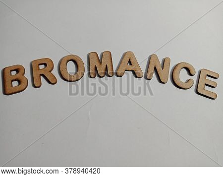 Bromance Latest Vocabulary Presented On White Paper Texture With Wooden Alphabets For Modern Communi