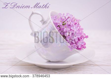 Beautiful Lilac Floers In Cup On Pink With Text Happy Mothers Day In Polish