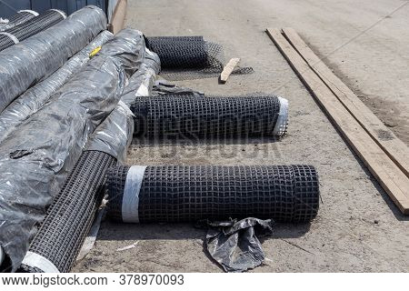 Rolls Of Geogrid For Reinforcement The Roadbed.