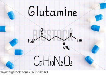 Chemical Formula Of Glutamine With Some Pills. Close-up.