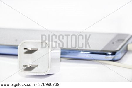 Mobile Phone Charging Cable White - Black On A White Background. Taken In A Studio In My House With 