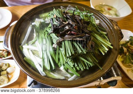 Korean Chicken Soup With Mushrooms And Chives.
