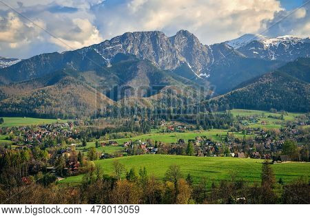 Beautiful Country View With Mountains In The Background. View Of The Tatra Mountains And Koscielisko