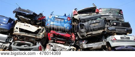 Neulehe, Germany - June 18 2023 Stacked Cars On The Grounds Of A Car Scrap Yard. This Has Specialize