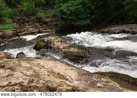 River Creek And Rocks In Lacamas Regional Park, Washington, Usa. Cascade Falls Over Mossy Rocks