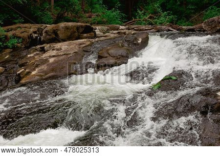 River Creek And Rocks In Lacamas Regional Park, Washington, Usa. Cascade Falls Over Mossy Rocks