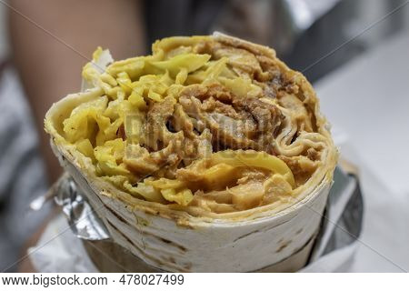 Shawarma Rolled Sandwich With Sauce And Vegetables, Arab Traditional Food. Shawarma Doner Kebab Wrap