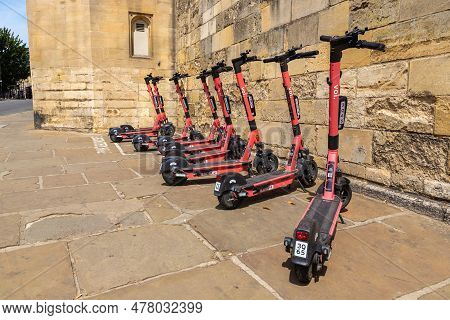 Oxford, Uk - June 11, 2022: Shared Electric Scooters For Rent By The Voi Company In A Street In Oxfo