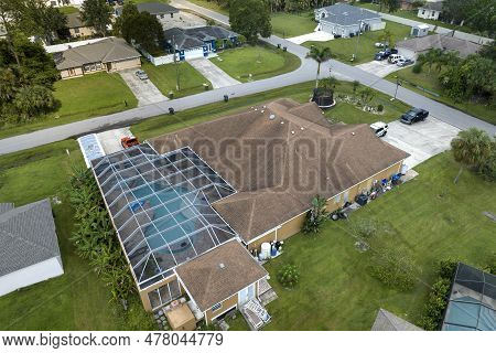 Aerial View Of Typical Contemporary American Private House With Outside Lanai Enclosure Covering Big