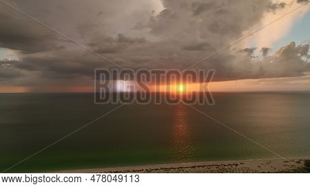 Dark Stormy Clouds Forming On Gloomy Sky During Heavy Rainfall Season Over Sea Baech Surface In Even