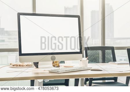 Empty Computer Monitor Screen For Design Mock Up Template In Modern Small Office Interior Or Home Of