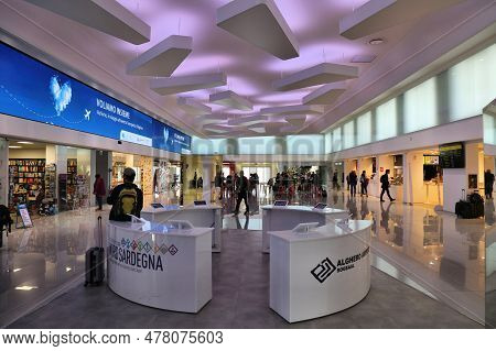 Alghero, Italy - May 30, 2023: People Visit Alghero Fertilia Airport In Sardinia Island In Italy.
