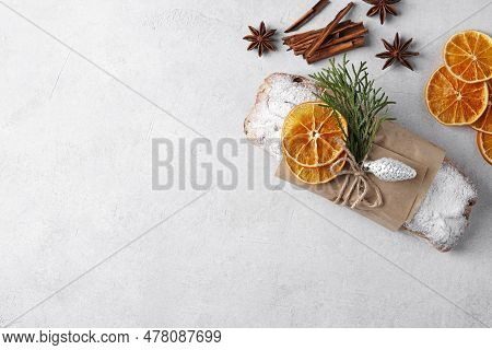 Border With Christmas Stollen Cake, Tree Branches And Decor On Light Table. Top View, Copy Space
