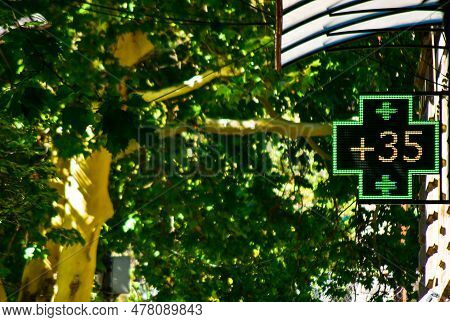 Thermometer In Green Pharmacy Screen Sign Displays Extremely Hot Temperature Of 35 Degrees Celsius D