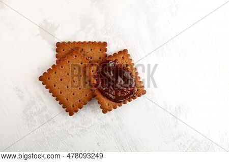 Rye Crackers With Vegemite Spread On Light Grey Textured Background, Top View. Vegemite Is A Very Po