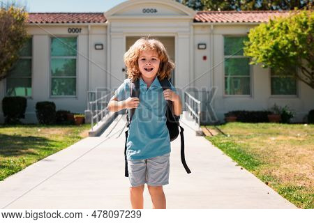 Child Pupul With Rucksacks In The Park Near School. Schoolboy With Backpacks Outdoors. Knowledge Day
