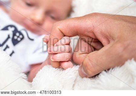 Sweet Tiny New Born Baby Hand Hold Mum Index Finger. Concept Relationship Between Mother Or Parants 