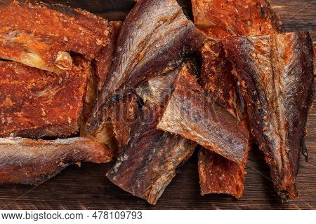 Pieces Of Cleaned Dried Fishbackground. Dry Peppered Pollack. Amber With Pepper Collection.