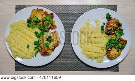 Pasta Orzo In The Form Of Rice With Meat. Dish For Two People On A Wooden Table. Fried Chicken With 