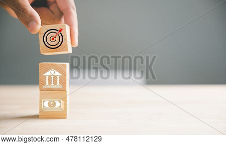 Wood Block Stacking Guided By A Hand Symbolizes A Strategic Business Plan And Action Plan, Focusing 