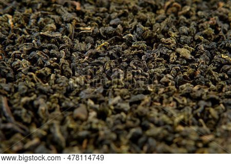 Loose Leaf Of Tea. Black Dry Tea Wallpaper. Mix Black And Green Tea Leaves. Close Up, Macro. Top Vie