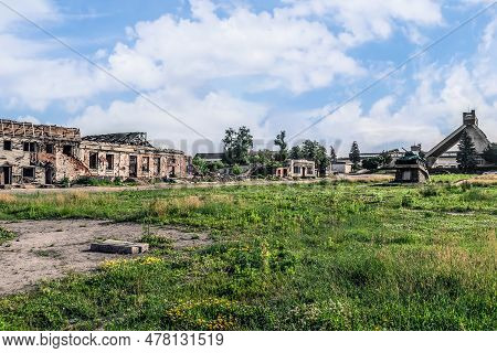 Broken Ploshcha 40-yi Armiyi Square In Trostyanets Is Overgrown With Weeds Against The Background Of
