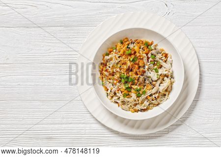Chicken Rice Casserole D Iberville Topped With French Fried Onion And Crumbled Crackers In Bowl On W