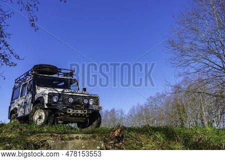 Close-up From The Front And From Below A Mound, Above Some Stairs
 Of A Land Rover Defender, Overlan